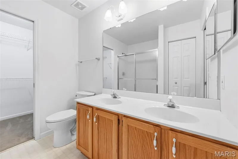 Primary Bath walkthrough to walk-in closet to make getting ready a breeze! — 199 Southern Oaks Drive, St Charles, MO 63303