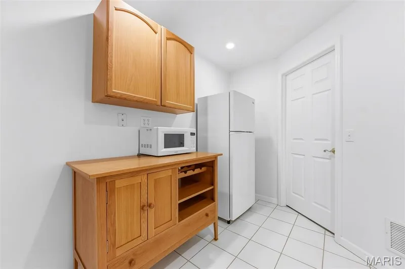 Refreshment area with full sized refrigerator. — 199 Southern Oaks Drive, St Charles, MO 63303