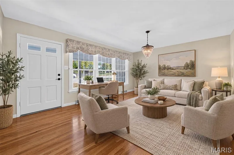 Virtually staged to showcase this flexible front living space with both conversation seating and a work-from-home area. — 2913 Cypress Drive, St Charles, MO 63301