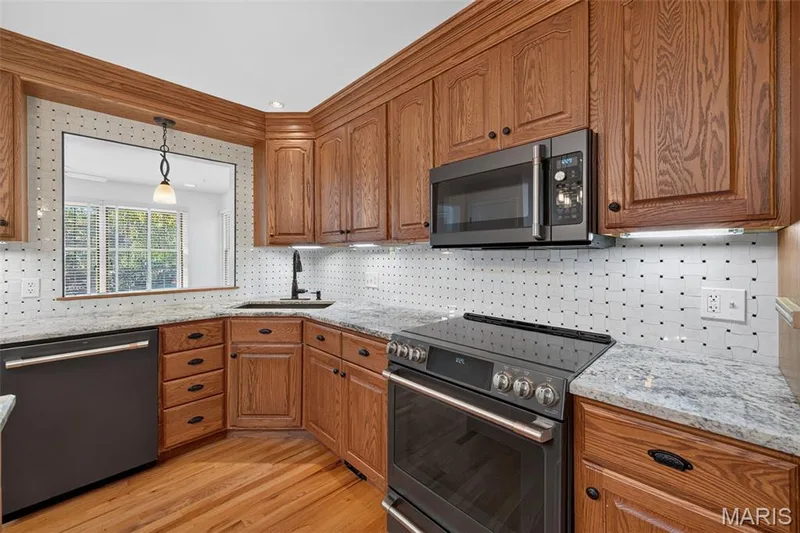 Plenty of workspace and storage and an easy connection to the surrounding living spaces. — 2913 Cypress Drive, St Charles, MO 63301
