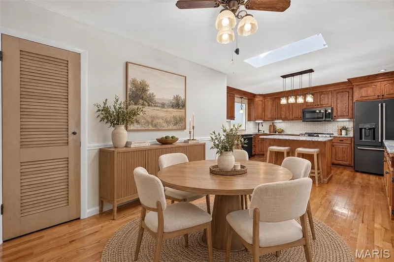 Virtually staged to illustrate the kitchen’s casual dining area and its connection to the family room. — 2913 Cypress Drive, St Charles, MO 63301