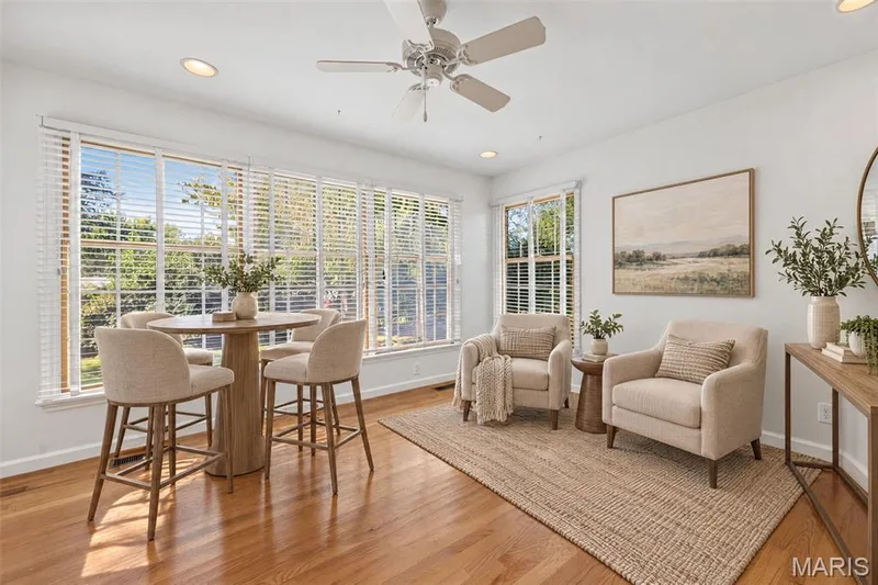 Virtually staged as a casual gathering space just off the kitchen, ideal for relaxing or entertaining. — 2913 Cypress Drive, St Charles, MO 63301