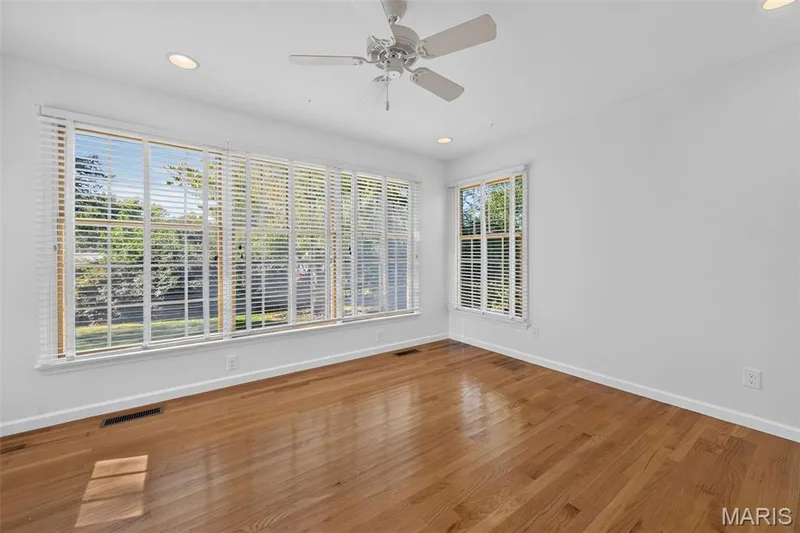 Walls of windows fill this versatile space with natural light. — 2913 Cypress Drive, St Charles, MO 63301