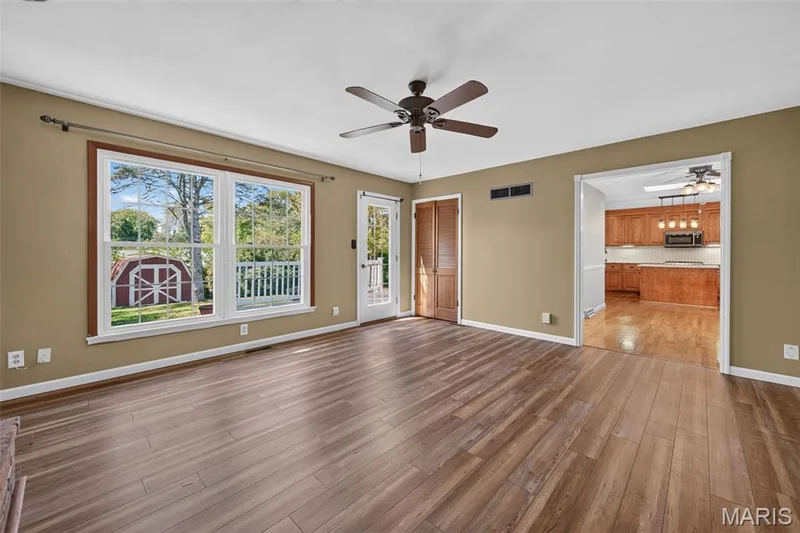 Looking back toward the kitchen, this view shows how the family room connects with the heart of the home. — 2913 Cypress Drive, St Charles, MO 63301