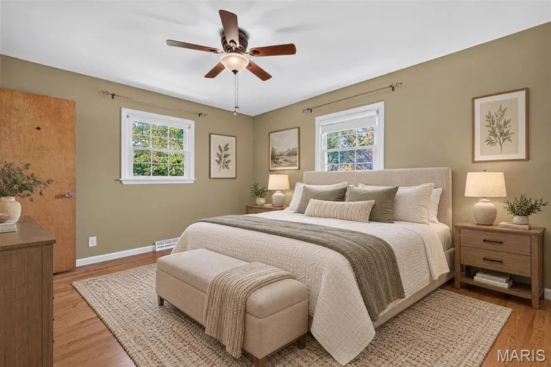 Virtually staged primary bedroom demonstrates the room’s comfortable scale and furniture possibilities. — 2913 Cypress Drive, St Charles, MO 63301