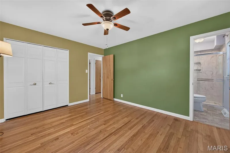 Another view of the primary bedroom showing its closet and private bath access. — 2913 Cypress Drive, St Charles, MO 63301