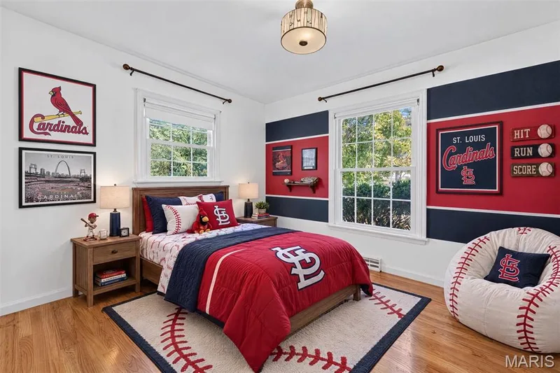 Virtually staged Cardinals-themed bedroom, incorporating the room's existing paint colors and memorabilia. — 2913 Cypress Drive, St Charles, MO 63301