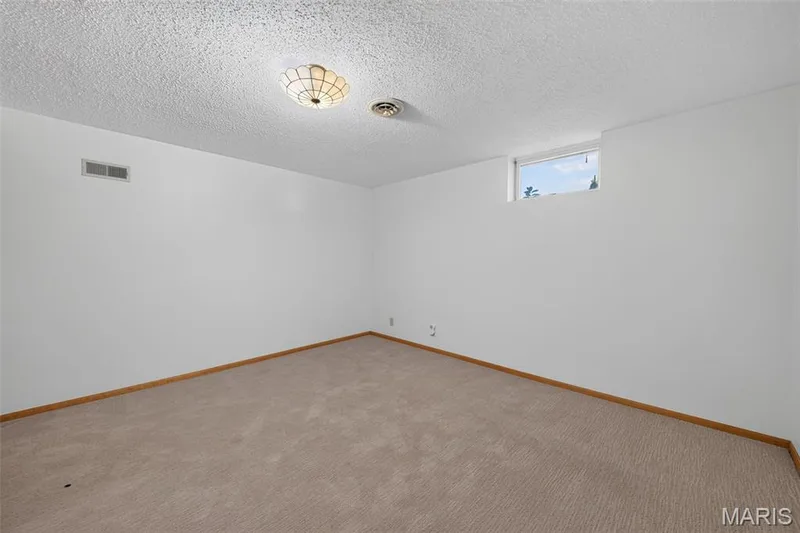 Separate lower-level bonus room offers possibilities for an office, hobby room or other flex space. — 2913 Cypress Drive, St Charles, MO 63301