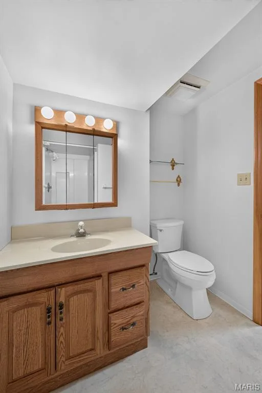 A full bathroom adds convenience to the finished lower level. — 2913 Cypress Drive, St Charles, MO 63301