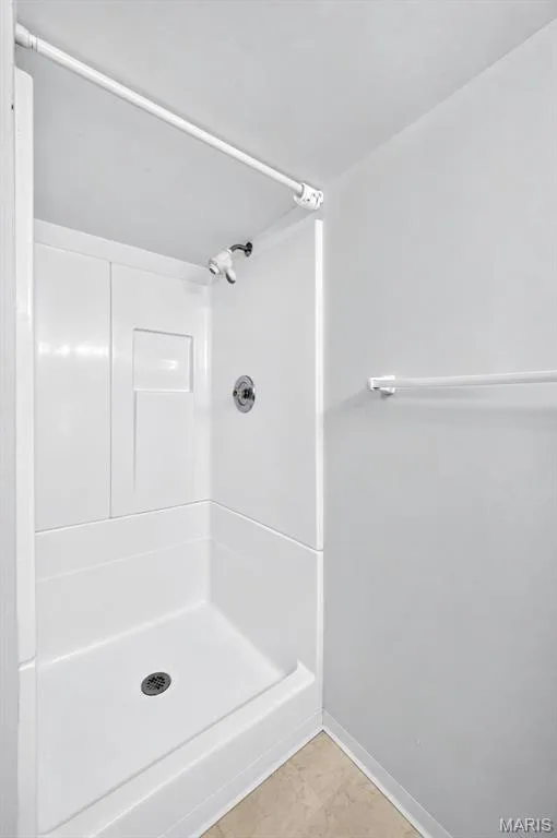 Lower-level full bath includes a walk-in shower. — 2913 Cypress Drive, St Charles, MO 63301