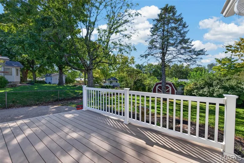 Composite deck overlooks the backyard and provides convenient outdoor living space. — 2913 Cypress Drive, St Charles, MO 63301