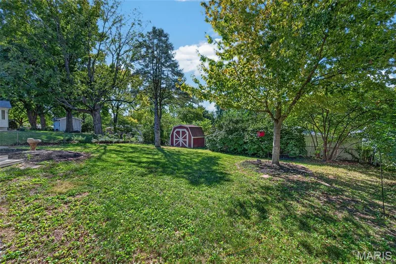 Wide backyard view showcases the depth of the lot and mature surroundings. — 2913 Cypress Drive, St Charles, MO 63301