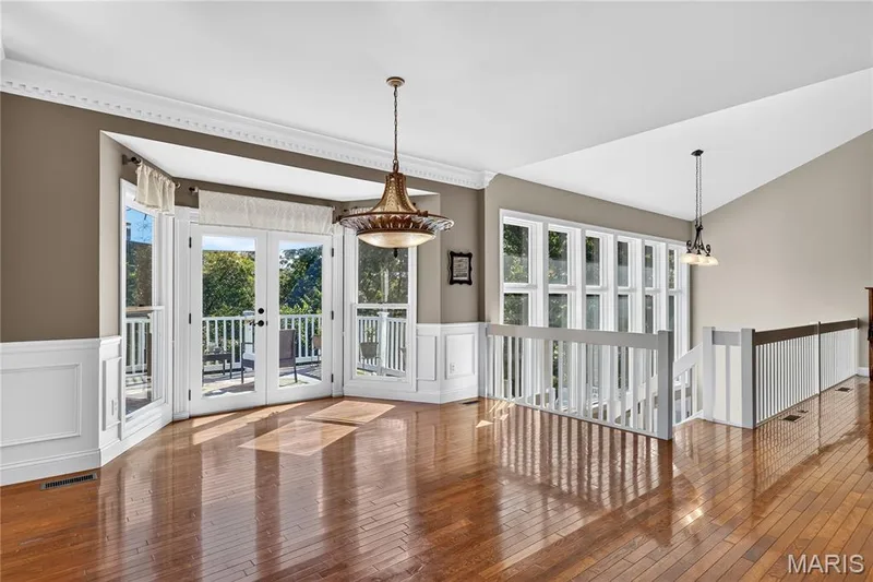 Hardwood flooring, white wainscoting, and crown molding — 17711 Birch Leaf Court, Chesterfield, MO 63005