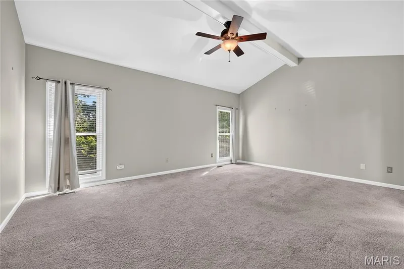 Vaulted ceiling with exposed beam, ceiling fan, and recessed lighting — 17711 Birch Leaf Court, Chesterfield, MO 63005