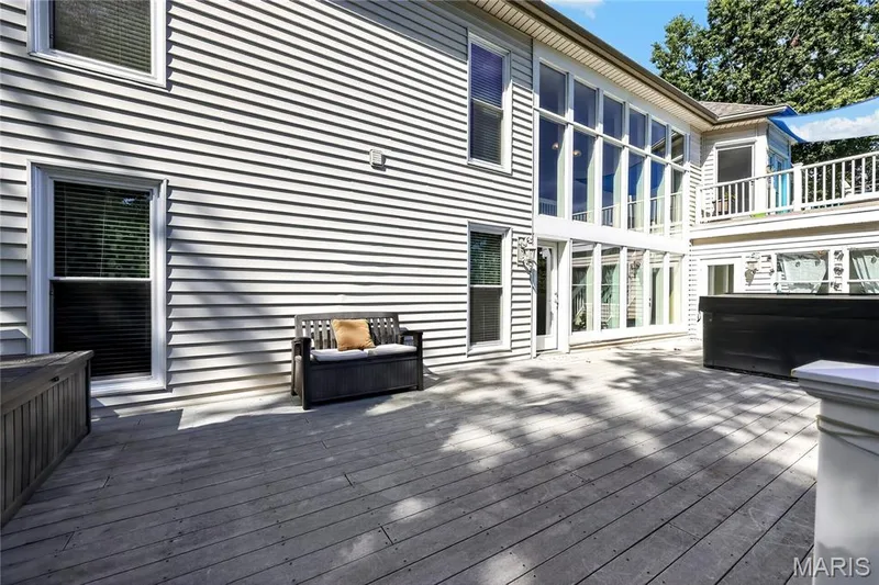 Exterior siding with multiple windows and a balcony — 17711 Birch Leaf Court, Chesterfield, MO 63005