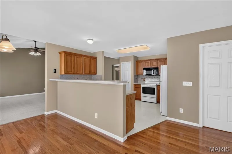 Wood floors in the breakfast area and kitchen. Freshly painted. — 11 Swift Creek Court, St Peters, MO 63376