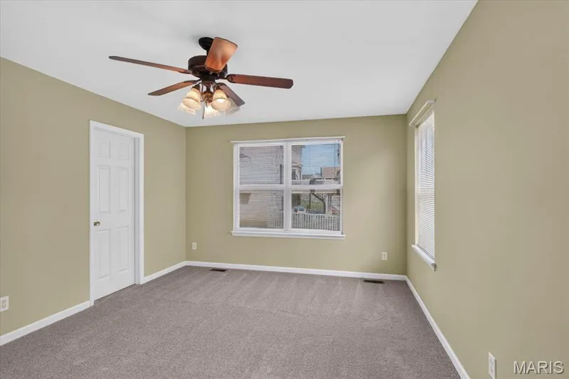 Primary bedroom with walk in closet, ceiling fan and it's own private bath. — 11 Swift Creek Court, St Peters, MO 63376
