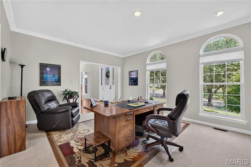Main floor front windows feature transoms above. — 947 Crown Pointe Estates Drive, Wildwood, MO 63021