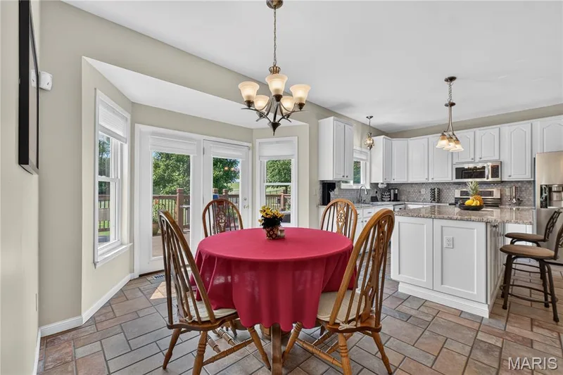 Breakfast room has large bay that opens to expansive deck. — 947 Crown Pointe Estates Drive, Wildwood, MO 63021