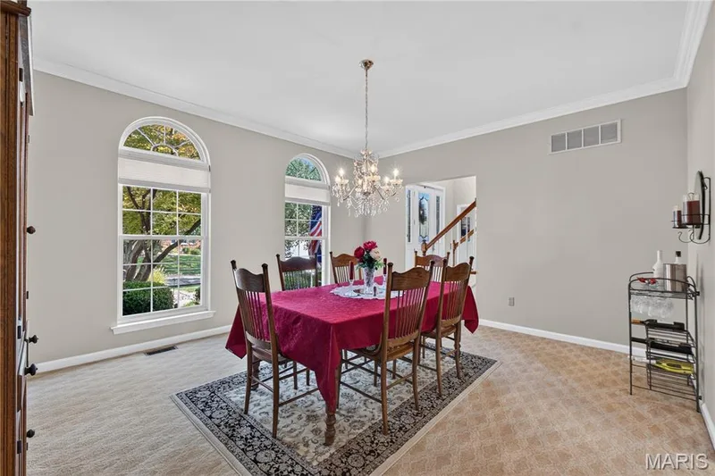 Formal dining allows large table and features traditional crystal chandelier. — 947 Crown Pointe Estates Drive, Wildwood, MO 63021
