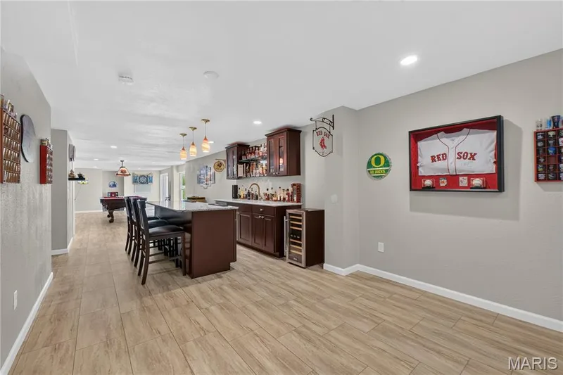 Fabulous lower level offers entertaining space with stunning bar. — 947 Crown Pointe Estates Drive, Wildwood, MO 63021