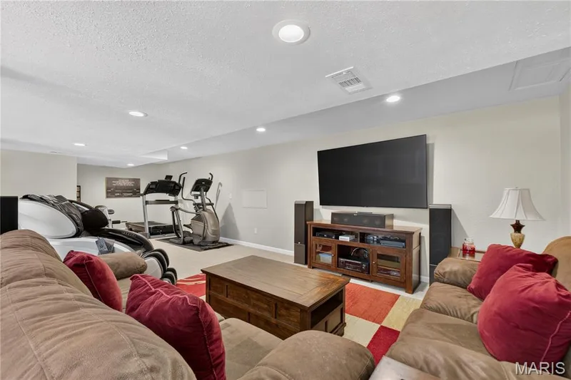 Enjoy lower level family room space. — 947 Crown Pointe Estates Drive, Wildwood, MO 63021