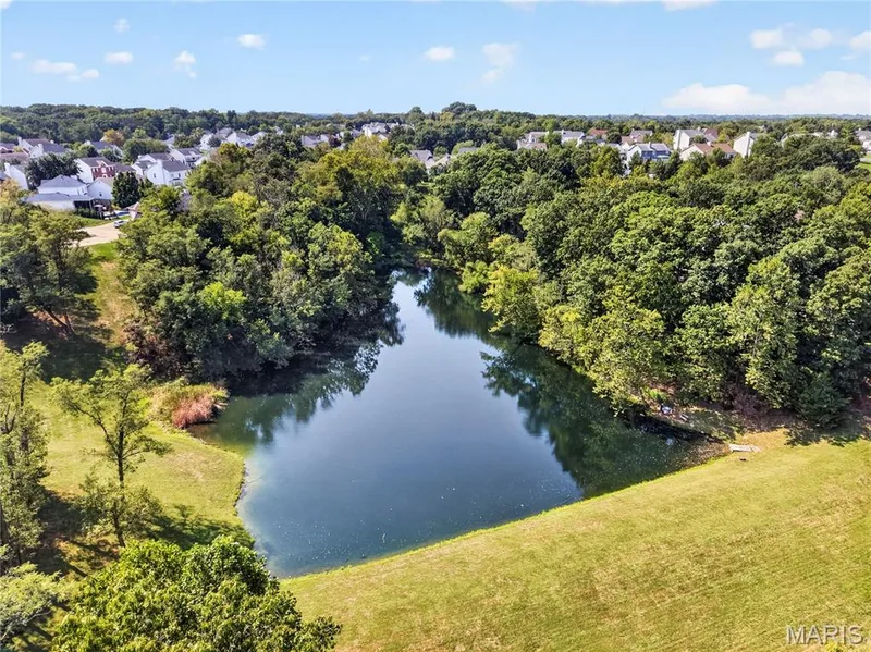 Drone view of subdivision pond. — 947 Crown Pointe Estates Drive, Wildwood, MO 63021