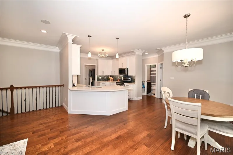 Kitchen open to living room and dining room. — 412 Cottage Grove Drive, Wentzville, MO 63385