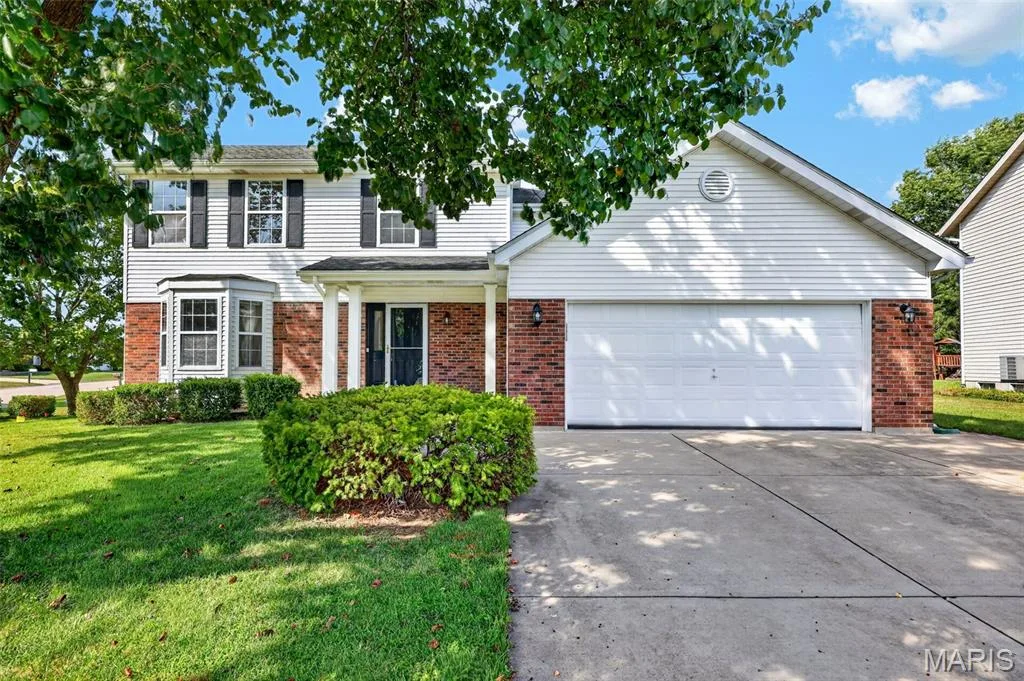 Two-story home with a white siding and brick exterior — 39 Green Pines Circle, St Peters, MO 63376