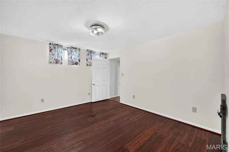 Wood-finish flooring with white walls and a white ceiling — 39 Green Pines Circle, St Peters, MO 63376