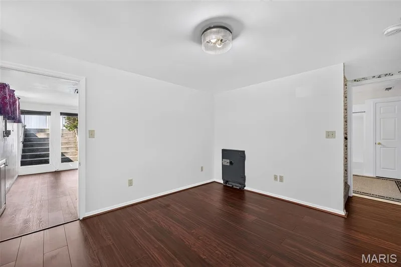 Wood-finish flooring throughout, white walls, and a flush mount ceiling fixture — 39 Green Pines Circle, St Peters, MO 63376