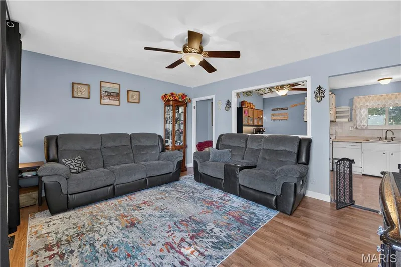 The living room features a large kitchen pass-through, creating a nice connection between the two spaces. — 2910 Nantwich Lane, St Charles, MO 63301