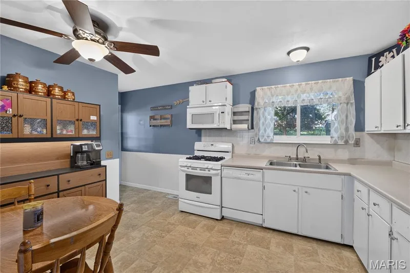Featuring a window with a backyard view and plenty of natural light. — 2910 Nantwich Lane, St Charles, MO 63301