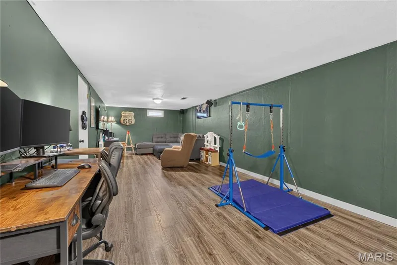 Additional living space downstairs with new flooring and fresh paint. — 2910 Nantwich Lane, St Charles, MO 63301