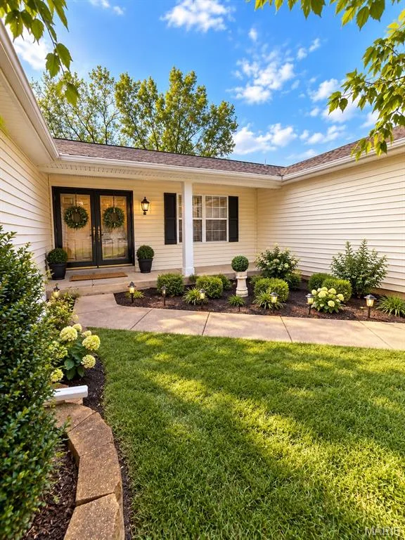 Cream-colored siding exterior with a dark shingle roof, virtually staged — 3 Fairfax Drive, St Peters, MO 63376