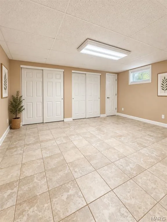 Textured tile flooring, recessed window with blinds, ceiling-mounted lighting fixture, and multiple storage closets with bi-fold doors — 3 Fairfax Drive, St Peters, MO 63376