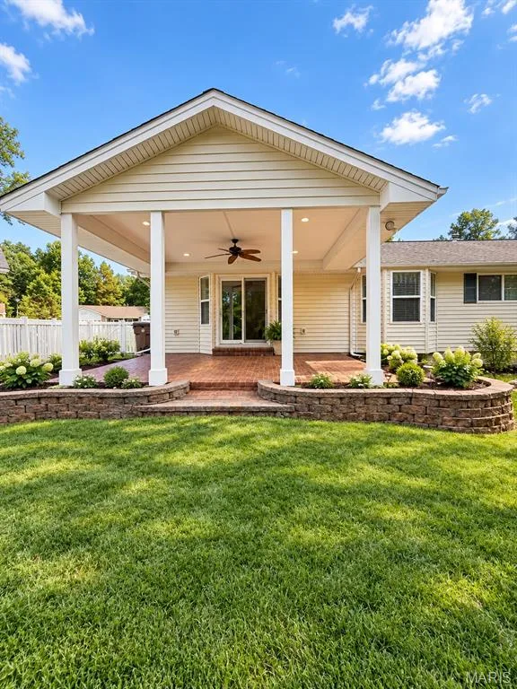 Covered patio featuring a ceiling fan, recessed lighting, and brick-laid flooring, virtually staged — 3 Fairfax Drive, St Peters, MO 63376