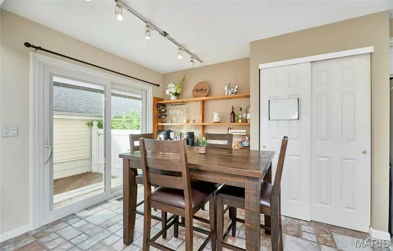 Patterned tile flooring, sliding glass door, track lighting, built-in shelving, bifold closet doors — 16500 Victoria Crossing Drive, Wildwood, MO 63040