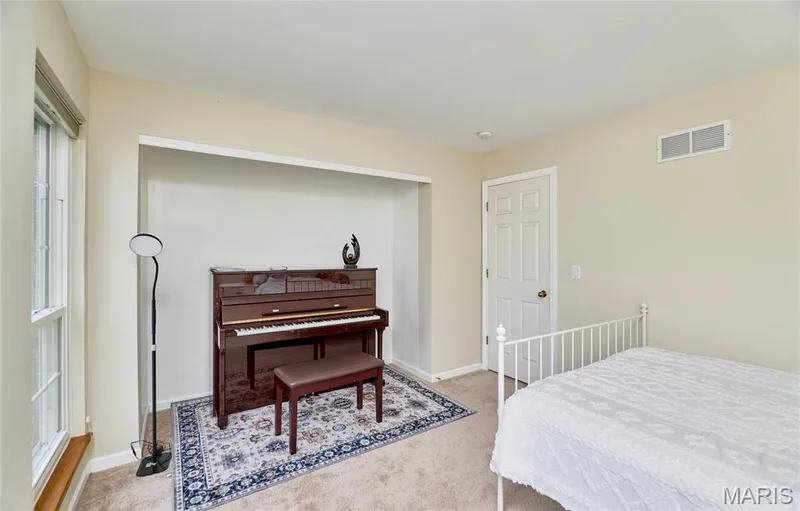 Recessed wall niche, single window with roller shade, neutral wall color, and carpeted flooring — 16500 Victoria Crossing Drive, Wildwood, MO 63040