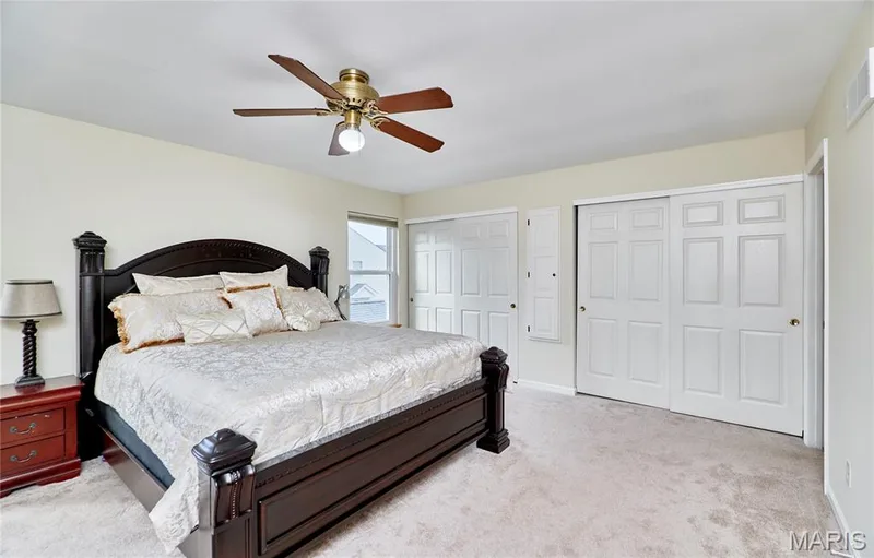 Carpeted flooring with light-toned walls, featuring a ceiling fan with integrated lighting — 16500 Victoria Crossing Drive, Wildwood, MO 63040