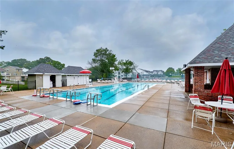 Outdoor swimming pool featuring multiple lanes and starting blocks — 16500 Victoria Crossing Drive, Wildwood, MO 63040