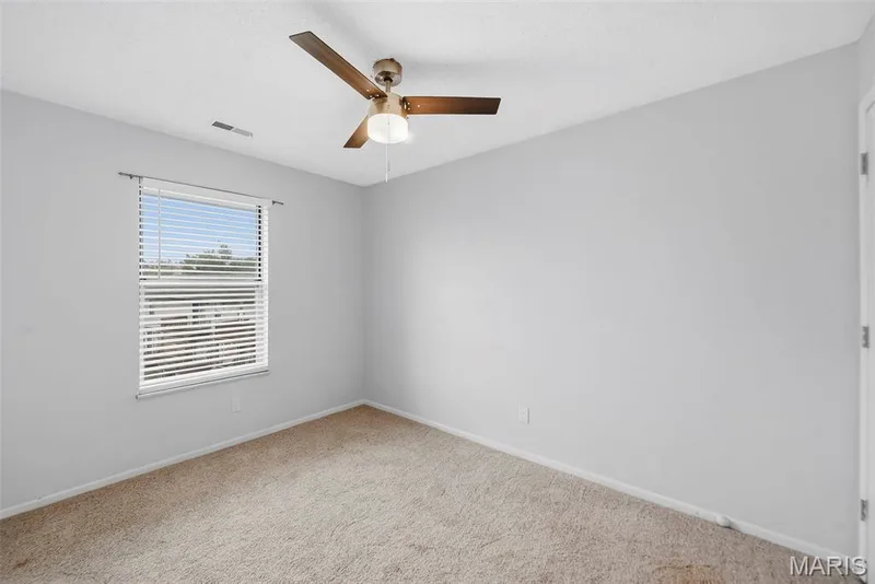 Bright bedroom with common ground view — 773 Delray Drive #D, St Peters, MO 63376