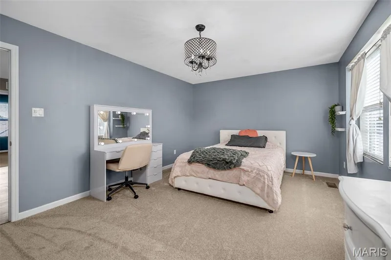 Plush carpet flooring complements soft blue wall finishes — 543 Country Chase Drive, Lake St. Louis, MO 63367