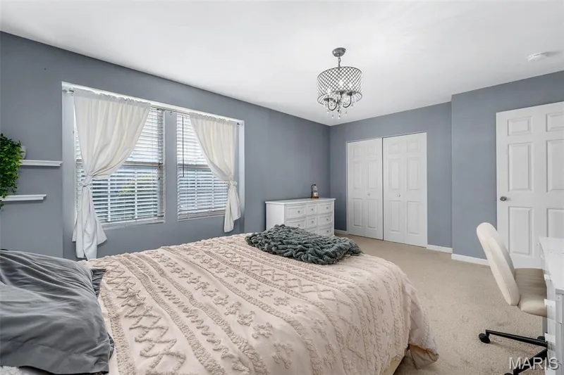 Recessed lighting, ceiling-mounted chandelier, carpet flooring, two paneled doors, and two windows with blinds — 543 Country Chase Drive, Lake St. Louis, MO 63367