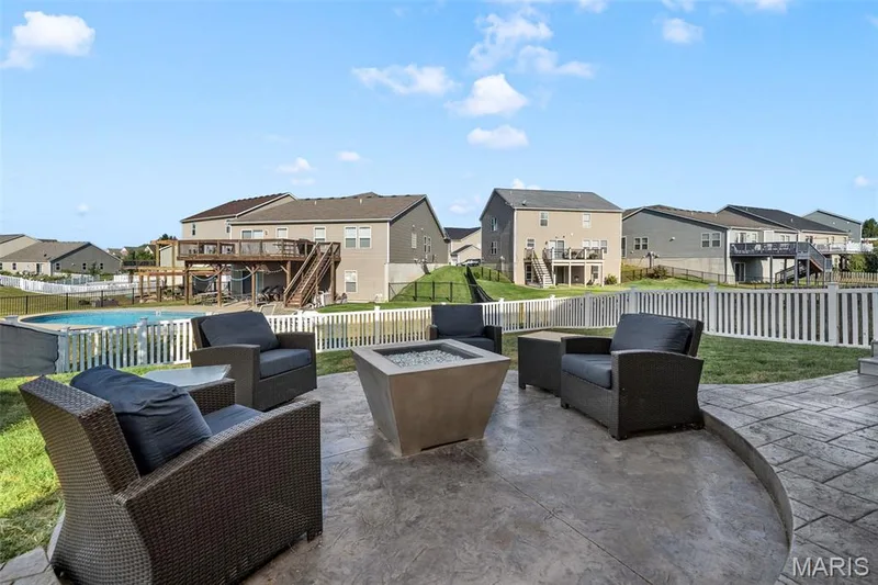 Stamped concrete patio with an integrated fire pit — 543 Country Chase Drive, Lake St. Louis, MO 63367