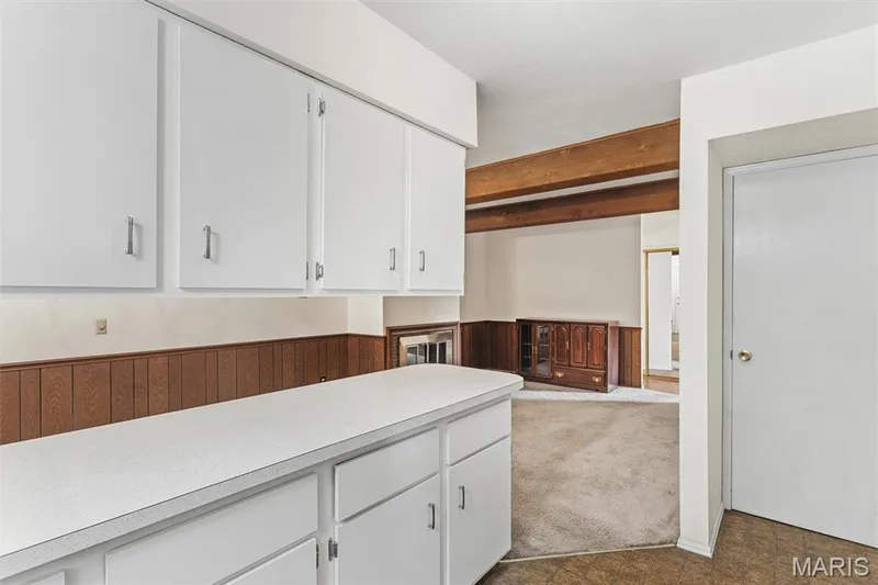 White upper and lower cabinetry with a light-colored countertop — 1192 Cantina Drive, Chesterfield, MO 63141