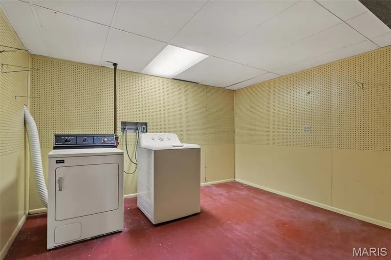 Dedicated laundry area with pegboard walls — 1192 Cantina Drive, Chesterfield, MO 63141