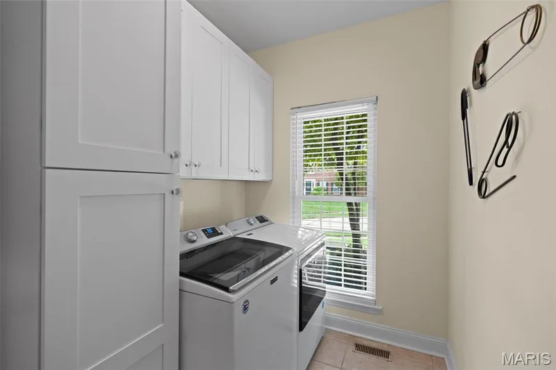Main Floor Laundry, cabinetry added 2025 — 16630 Highland Summit Drive, Ballwin, MO 63011