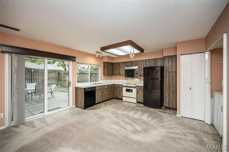 Patio doors lead to a private patio. — 1368 Hampton Road #A, St Charles, MO 63303