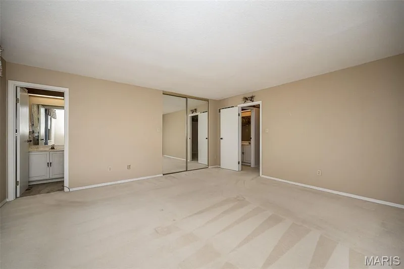 Primary bedroom features bathroom access and closet. — 1368 Hampton Road #A, St Charles, MO 63303